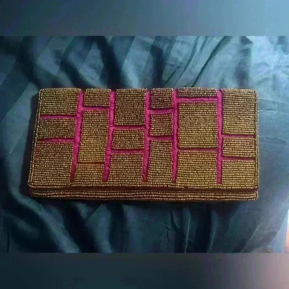 ExpressionsNYC clutch. Pick with gold beads. Good condition pink sink inside